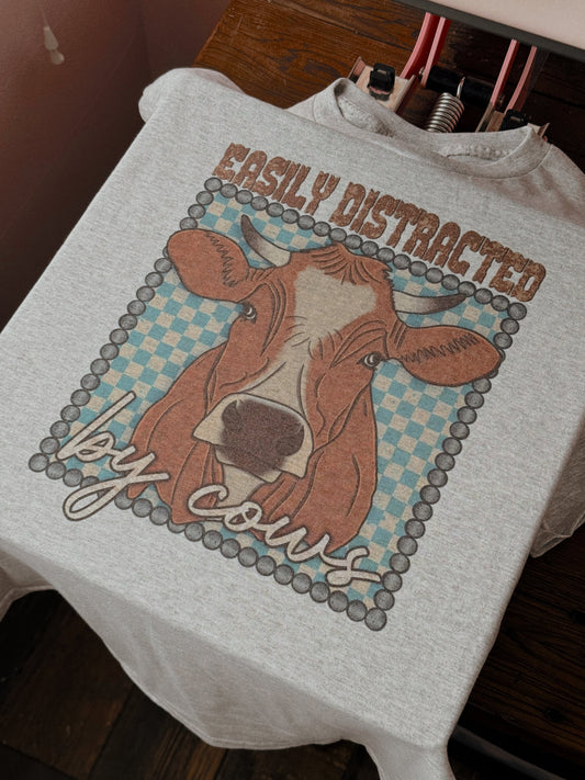 DISTRACTED BY COWS